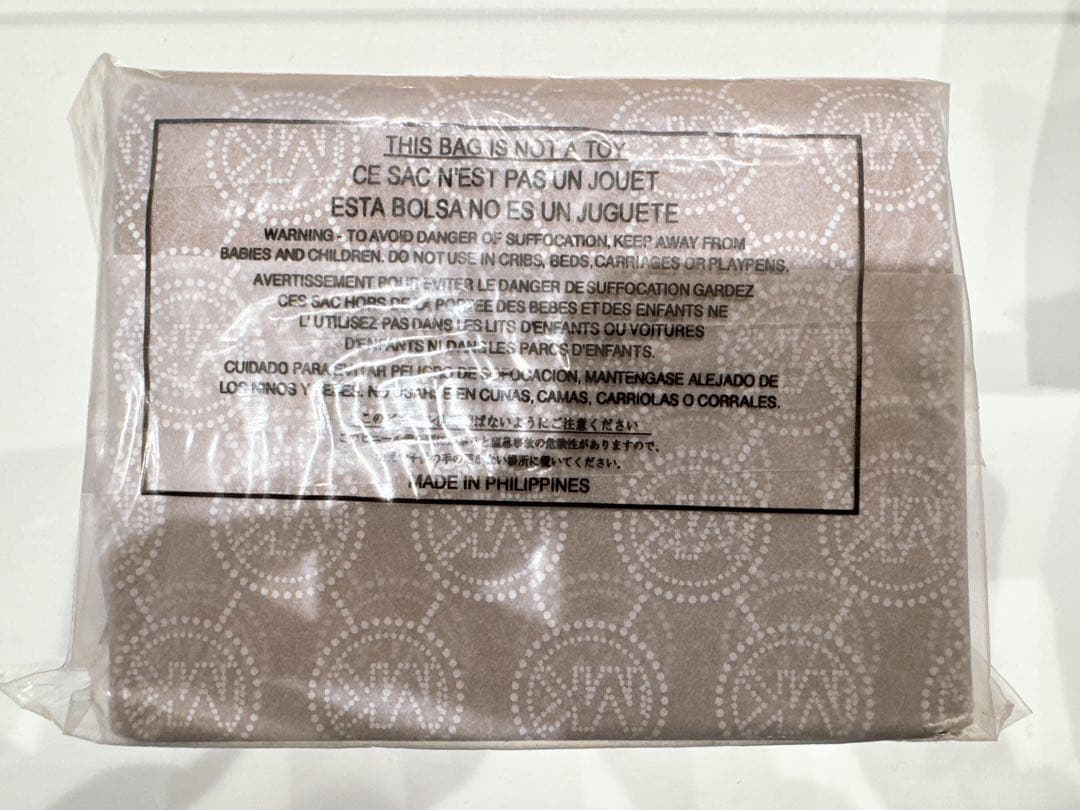 【新品未使用】マイケルコース 二つ折り財布 ラゲッジ 32T4GTVF2L