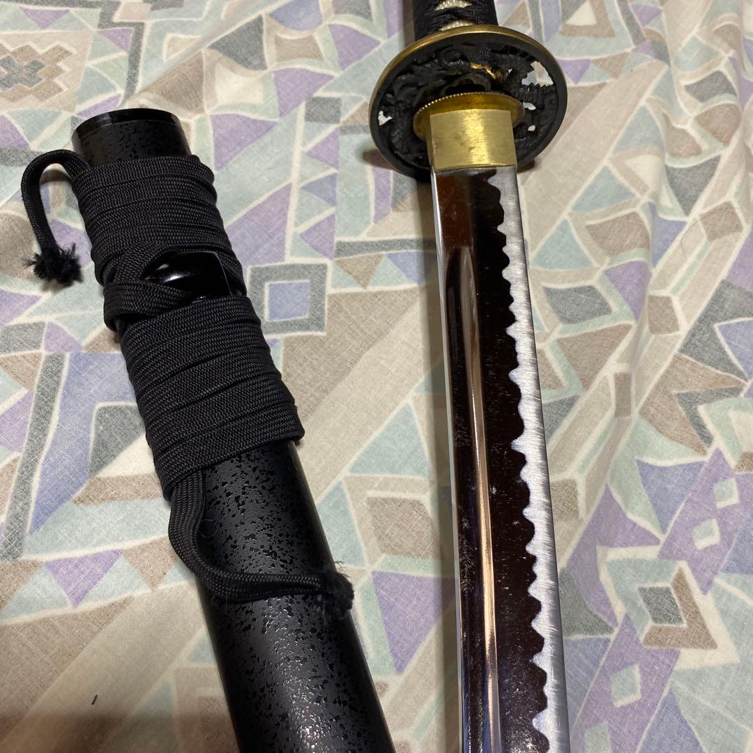 上級居合刀 黒柄 龍彫透し金縁丸鍔 黒梨地鞘